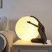 Humanoid Ball Holding Table Lamp - DWHOME