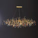 Chandelier en laiton coloré en forme de goutte de pluie et de branche - DWHOME
